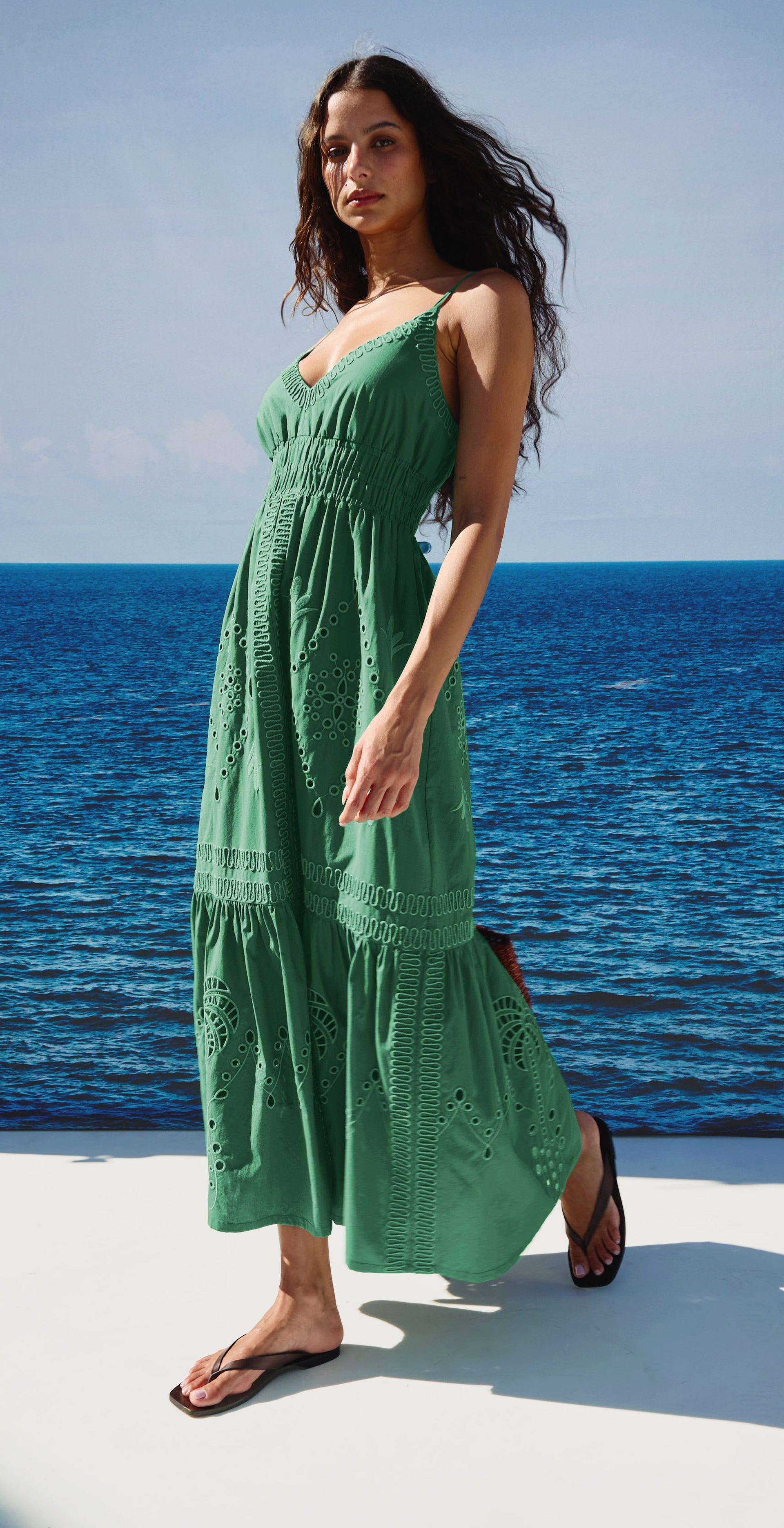 Woman in a green maxi dress dressed for summer