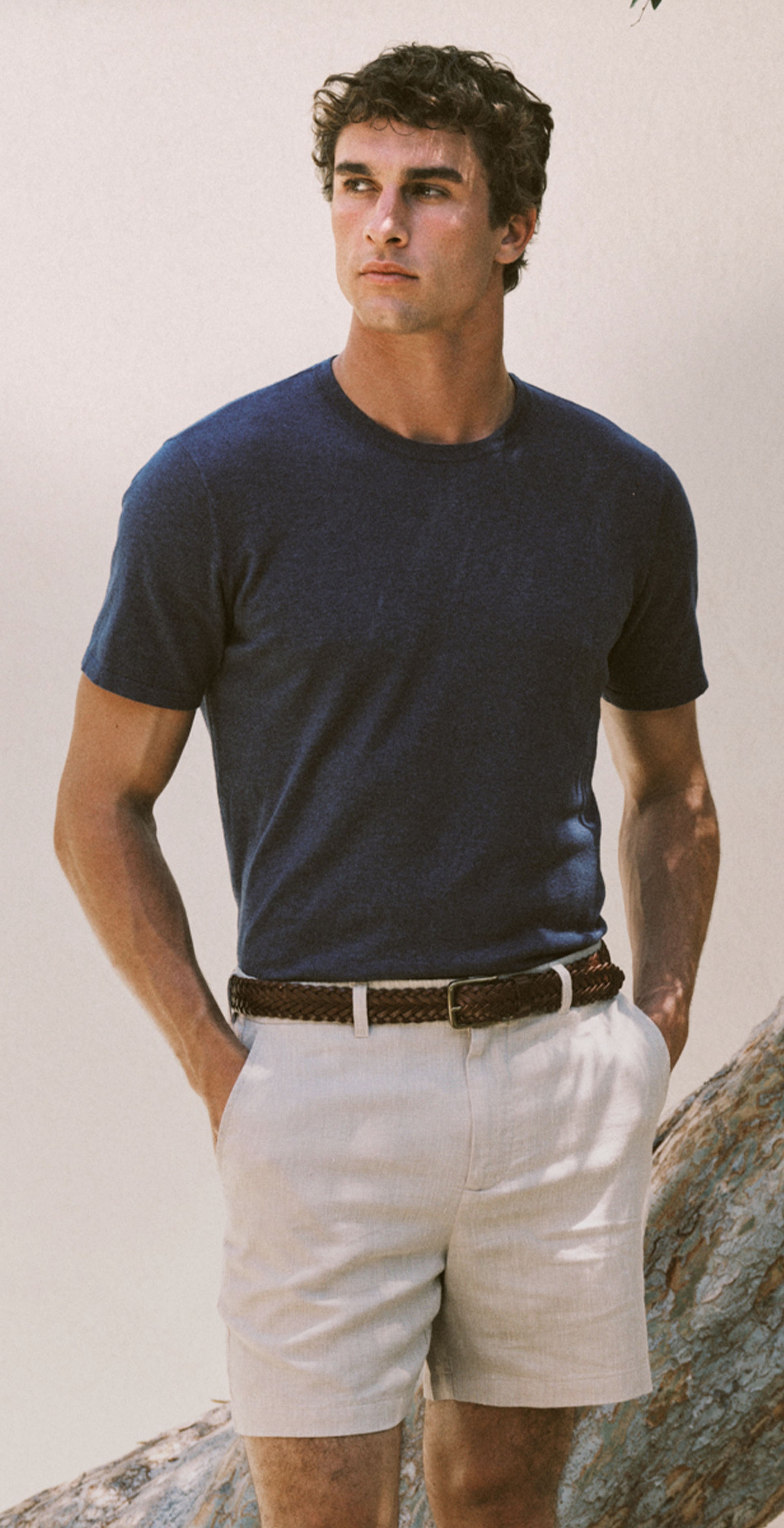 Man wearing a blue t-shirt and white shorts