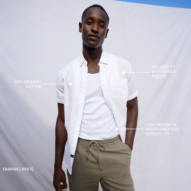 Man wearing a white shirt and beige pants with text labels on a gray background