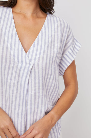 Nala Short-Sleeve Top with a Deep V Neck in Blue Iris Stripe Colorway, Vertical White and Blue Stripes - Front View Featured on Model 