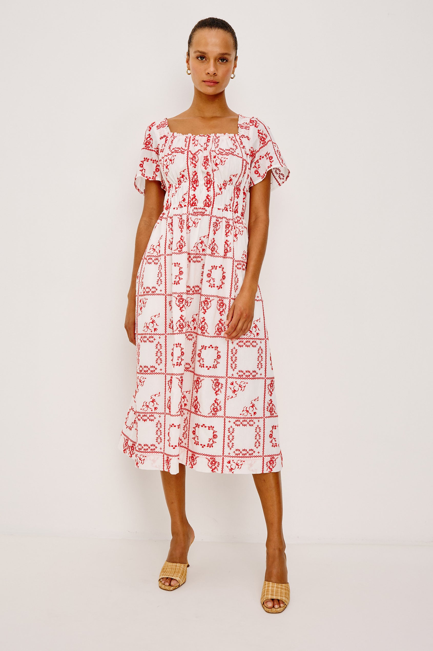 Nanette Midi Dress in Cotton Voile With Square Neckline, Underbust Elastic, Smocked Detailing, Short Sleeves, and is Fully Lined in Ivory Red Handkerchief Colorway - Full Body Front View Featured on Model