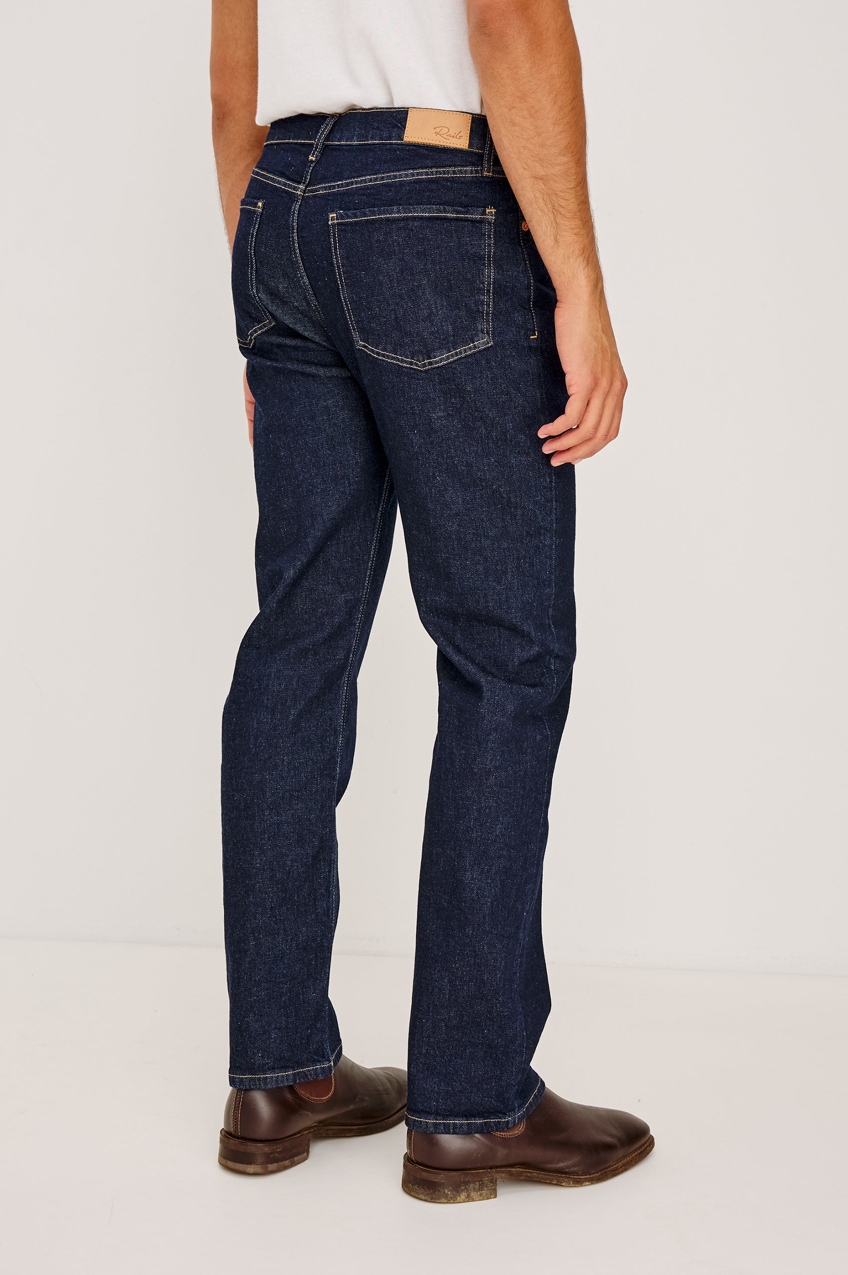Nash Straight Leg Jean in Comfort Strech Denim With 5-Pockets and Front Zip Fly in Rinse Wash Colorway - Lower Body Back View Featured on Model
