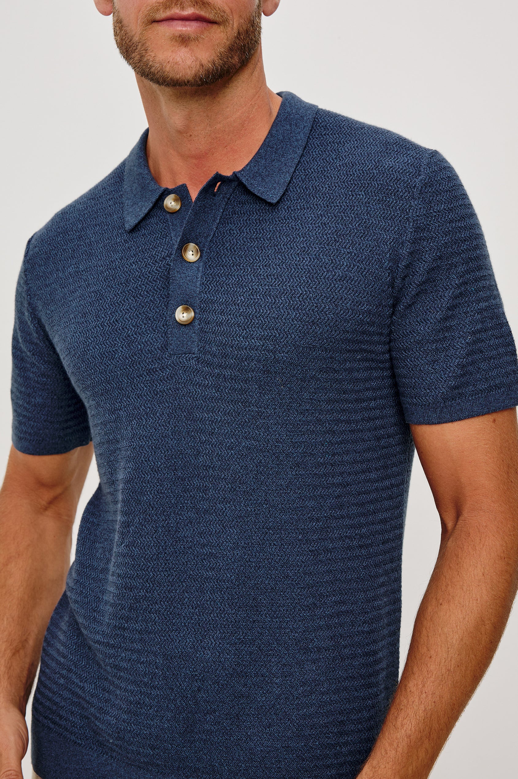 Nathan Polo Shirt in Cotton Blend Knit With Collar, Quarter Button Placket, and Short Sleeves in Harbour Colorway - Upper Body Front Close Up View Featured on Model