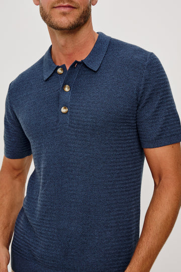 Nathan Polo Shirt in Cotton Blend Knit With Collar, Quarter Button Placket, and Short Sleeves in Harbour Colorway - Upper Body Front Close Up View Featured on Model