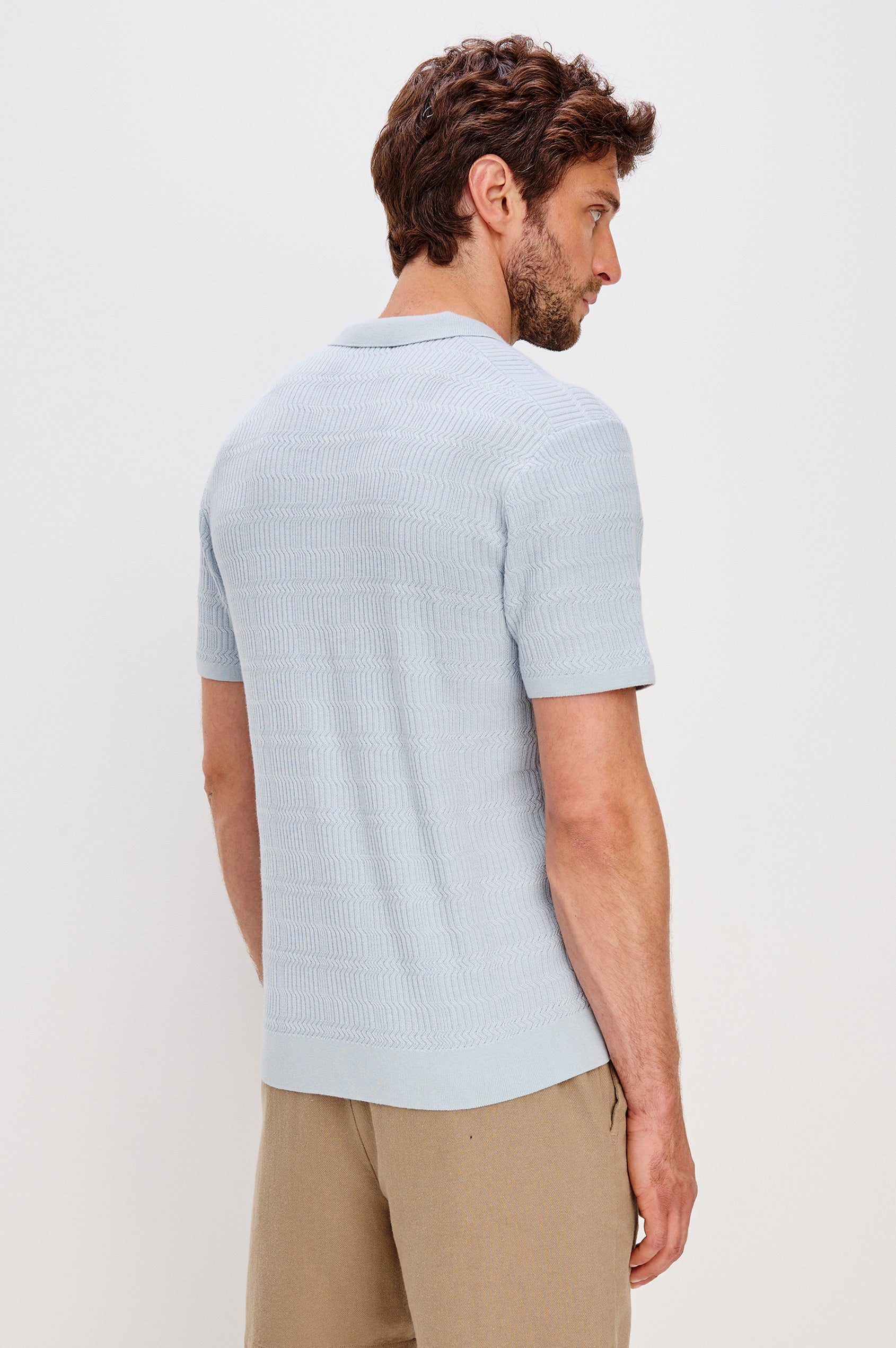 Nathan Short-Sleeve Polo Shirt with a Three-Button Placket and a Jacquard Pattern in Skyway Colorway - Back View Featured on Model