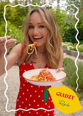 Woman in a red dress eating spaghetti outdoors with 'Gladzy' branding.