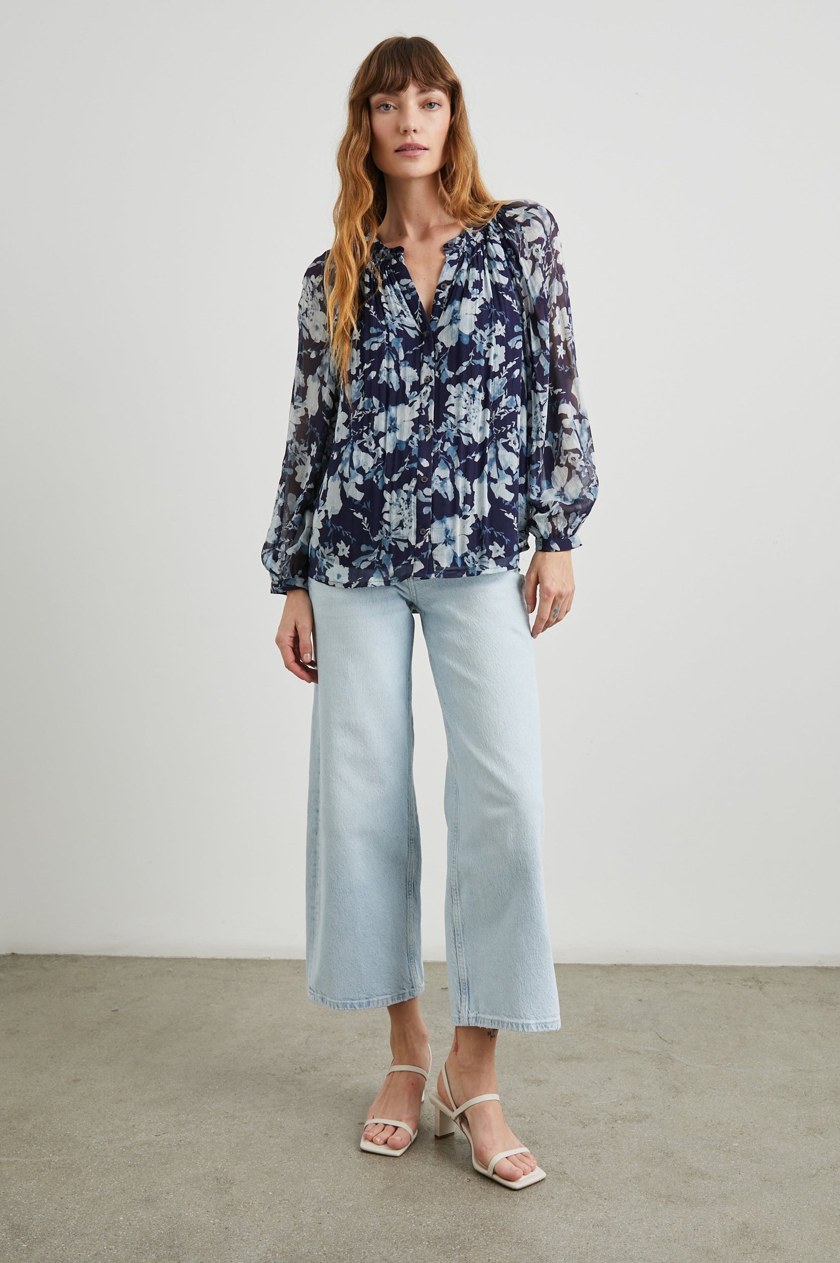 Nessie Long Sleeve Top with Front Button Closure and Ruching along the Neckline in Indigo Blossoms Colorway, Flowers in Blue on Indigo - Front Full Body View Featured on Model 