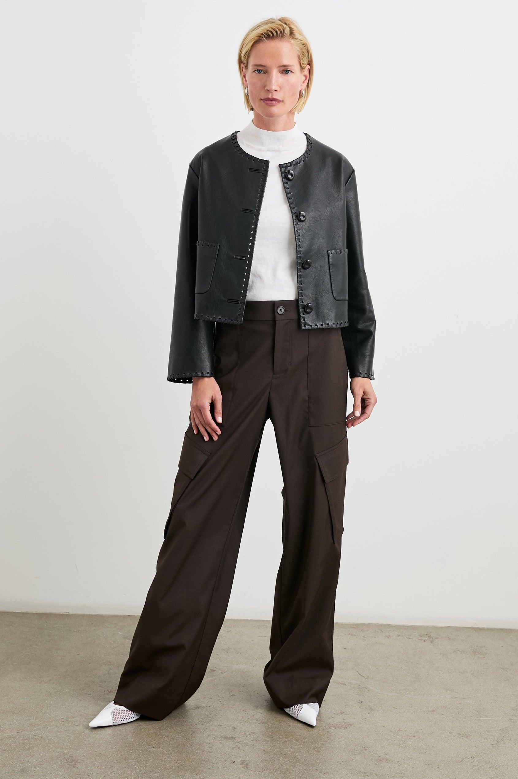 Nevina Jacket with Button Closure, Whip Stitch Trim and Two Front Patch Pockets in Black Colorway - Front Full Body View Featured on Model