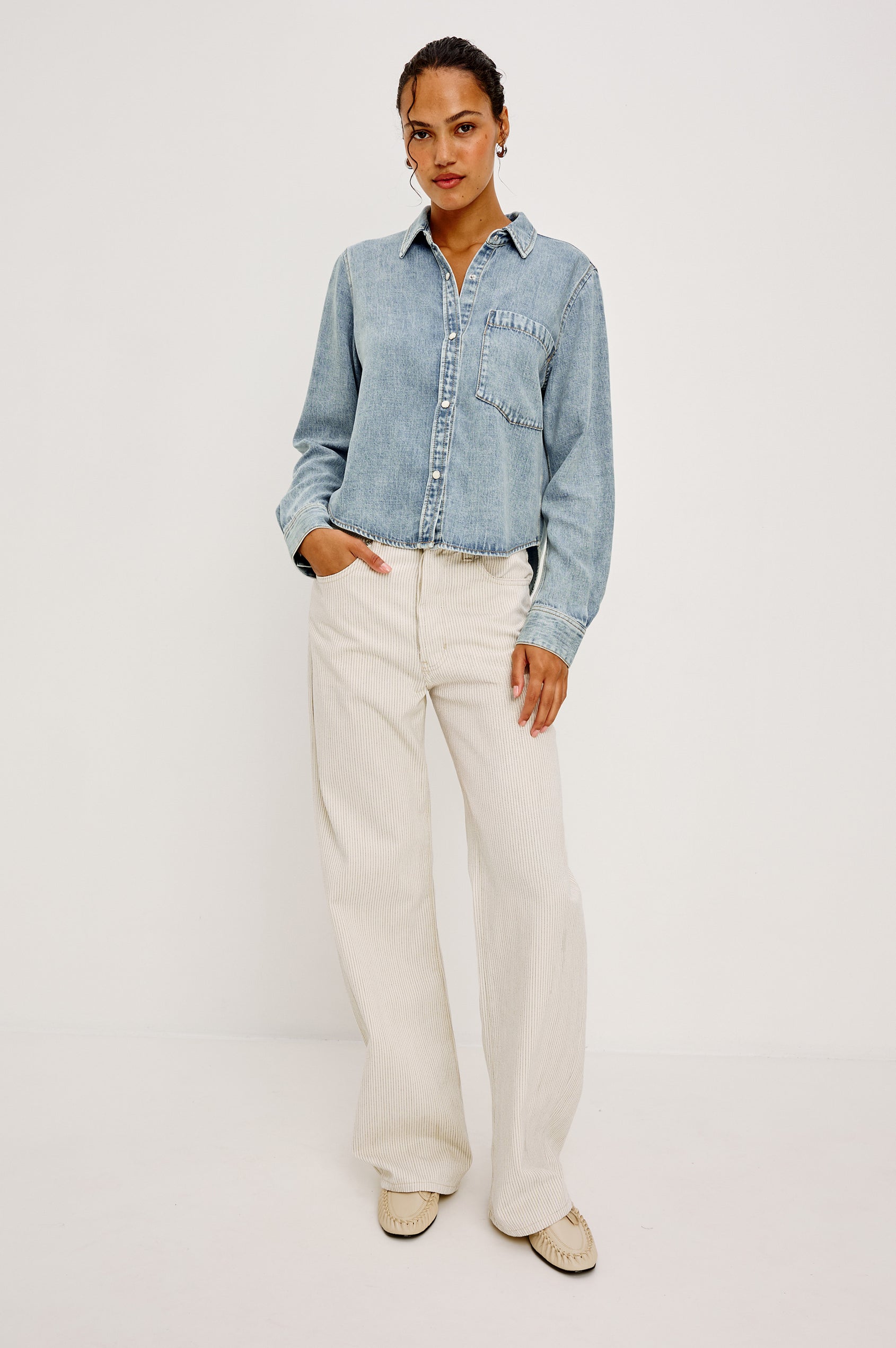 Noa Button-Up Shirt in Denim With Collar Front Buttons Single Chest Patch Pocket and Boxy Fit in Faded Indigo Colorway - Full Body Front View Featured on Model