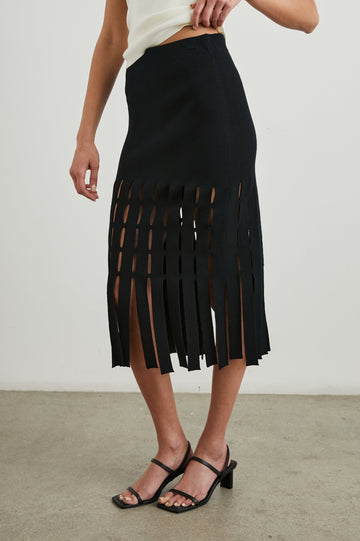 Nola Midi Skirt with Cutouts from the Mid-Thigh Down and Ending in Cut Panels in Black Colorway - Front View Featured on Model 