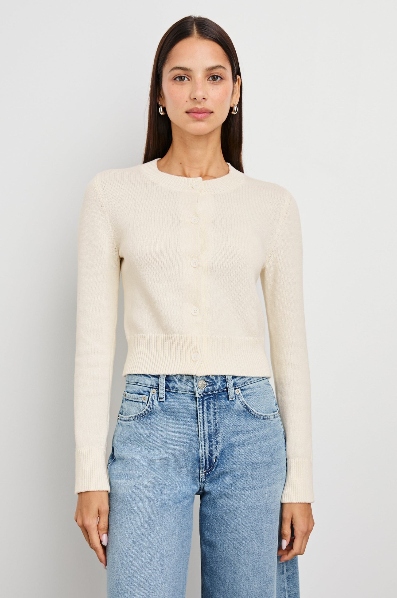 Norah Long-Sleeved Short Cardigan with Ribbed Trims and Matching Buttons in Ivory Colorway - Front View Featured on Model 
