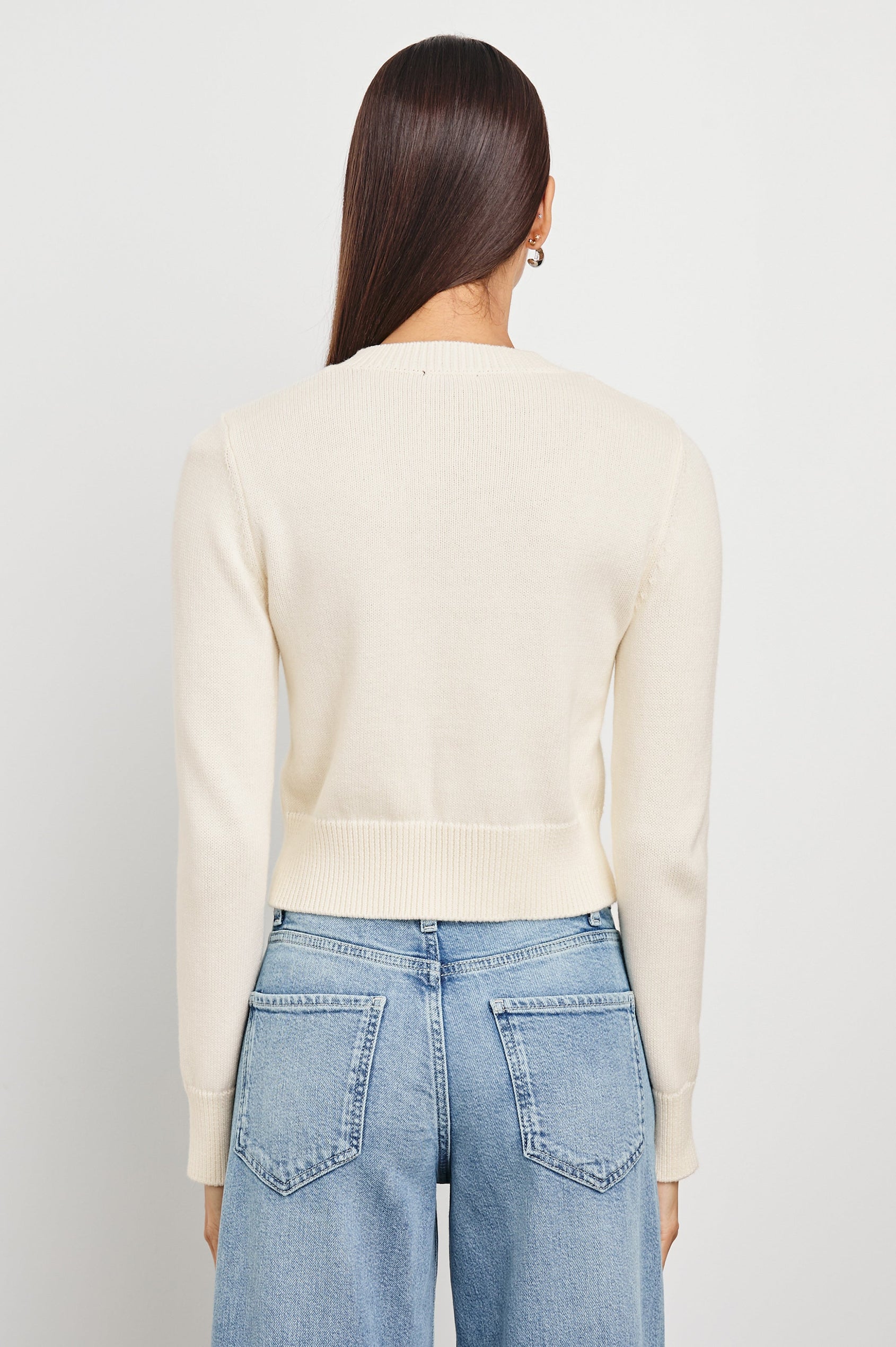 Norah Long-Sleeved Short Cardigan with Ribbed Trims and Matching Buttons in Ivory Colorway - Back View Featured on Model 