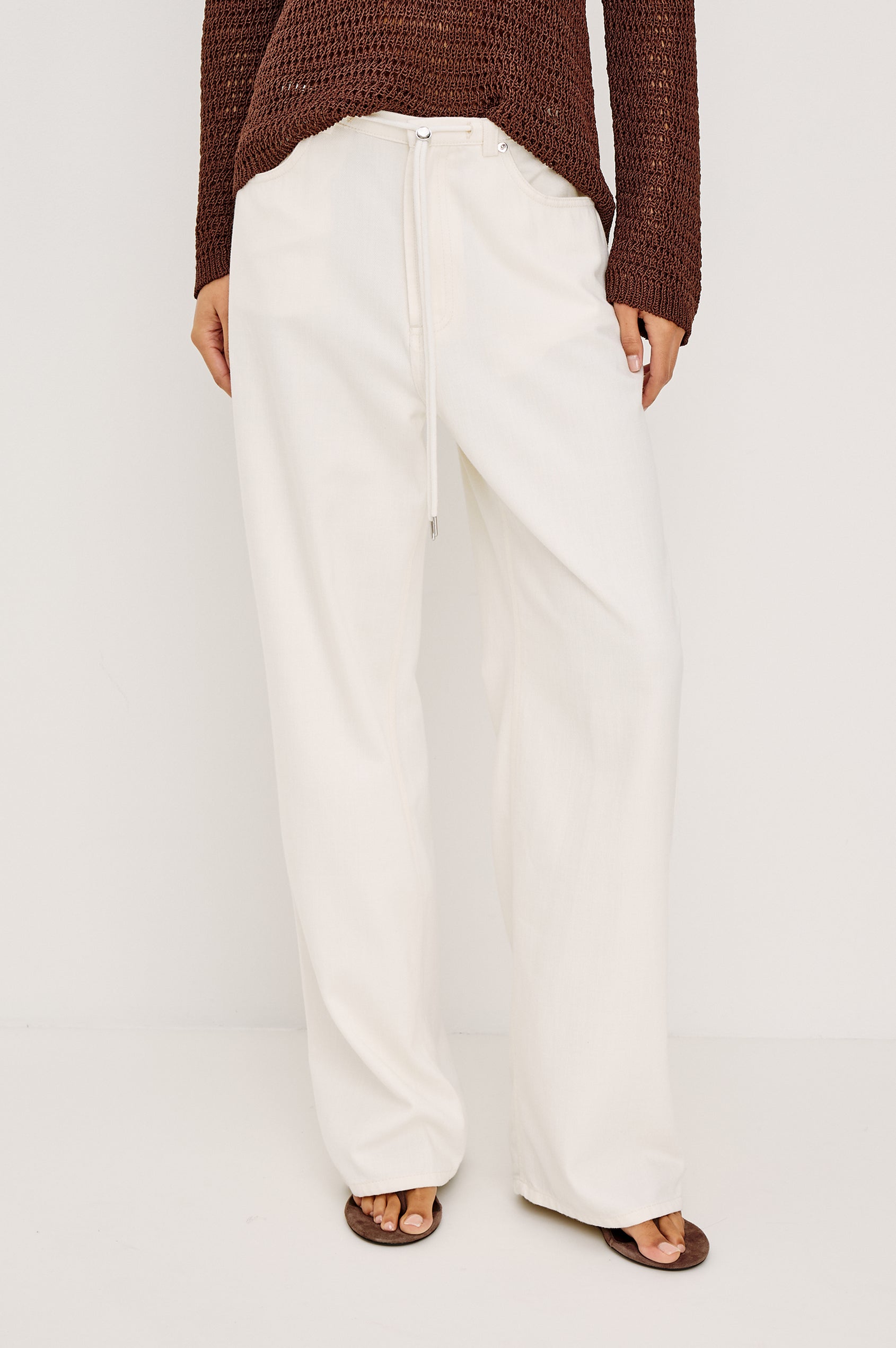 Normandie Relaxed Pant in Cotton Lyocell Denim With Adjustable Drawstring Toggles and 5-Pocket Styling in Ivory Colorway - Full Body Front View Featured on Model