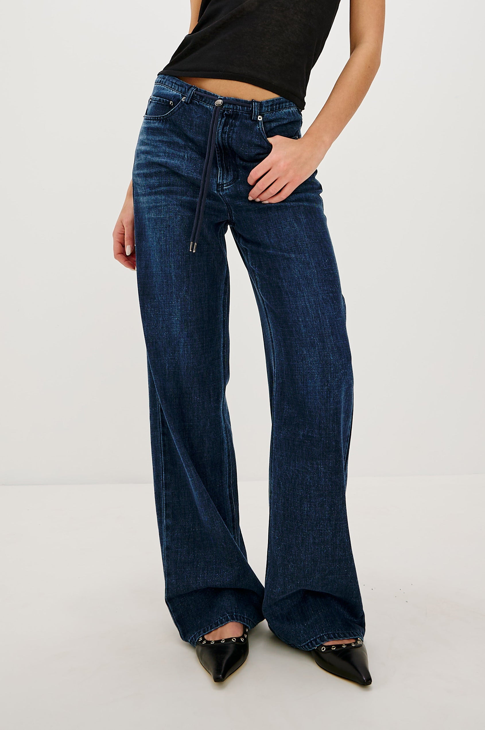 Normandie Lightweight 5-Pocket Denim Wide Leg Pant with front zipper button fly and a drawstring tie at waist in Oceana Colorway. Front View Featured on Model.