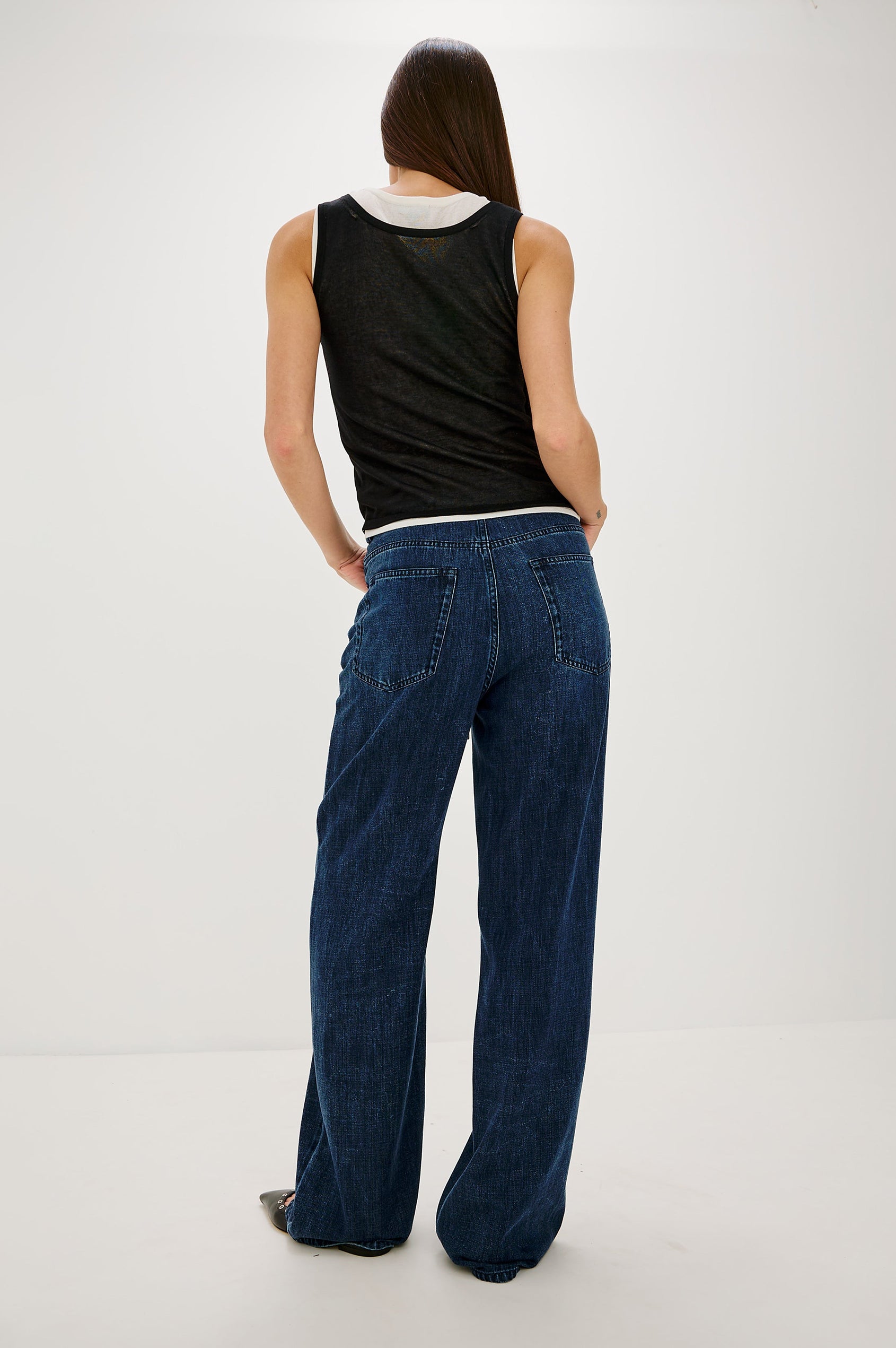 Normandie Lightweight 5-Pocket Denim Wide Leg Pant with front zipper button fly and a drawstring tie at waist in Oceana Colorway. Full Body Back View Featured on Model.