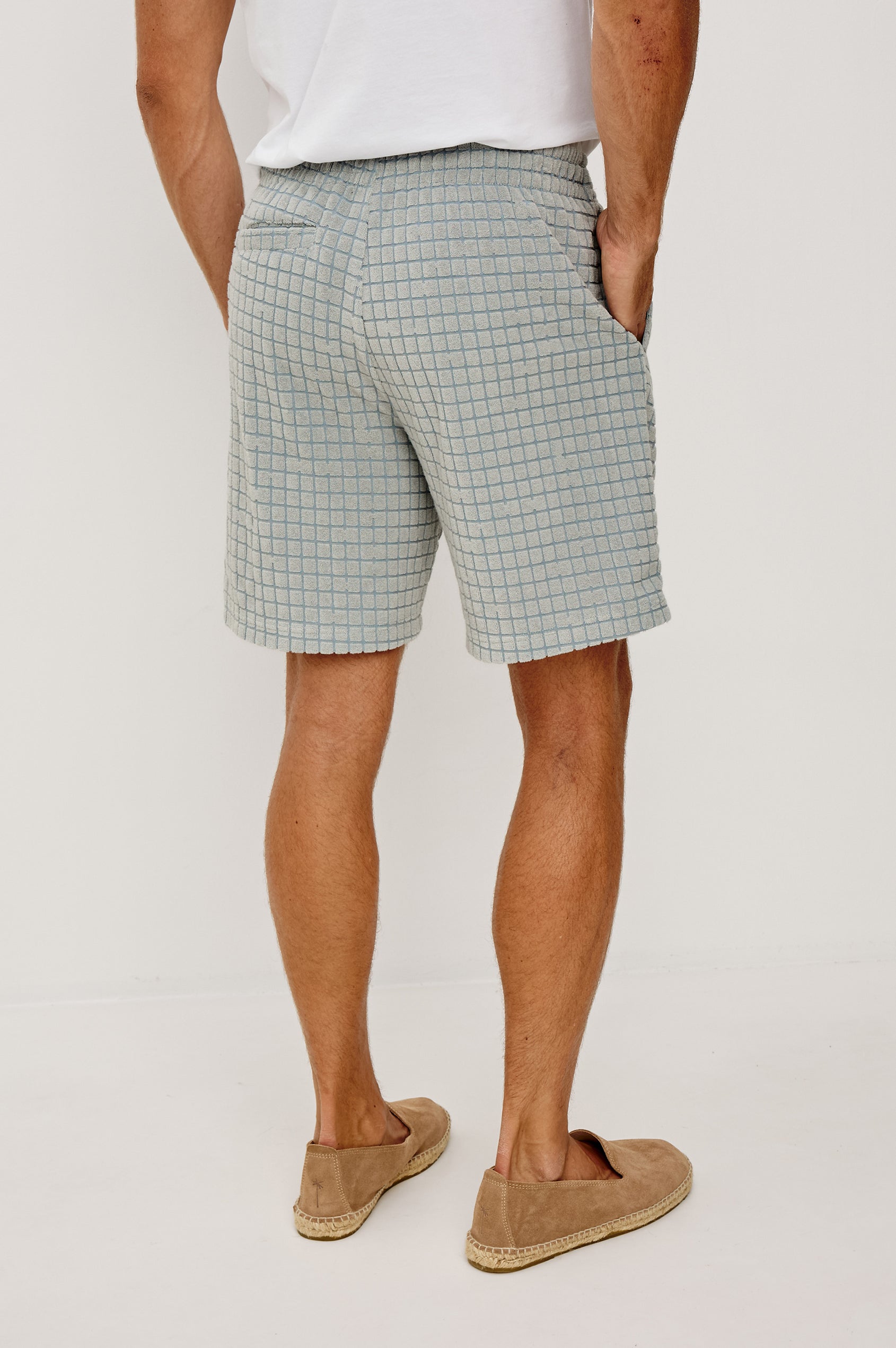 Nova Short in French Terry With Raised Jacquard Pattern, Side Pockets, and Drawstring Waist Ties in Silver Line Grid Colorway - Lower Body Back View Featured on Model