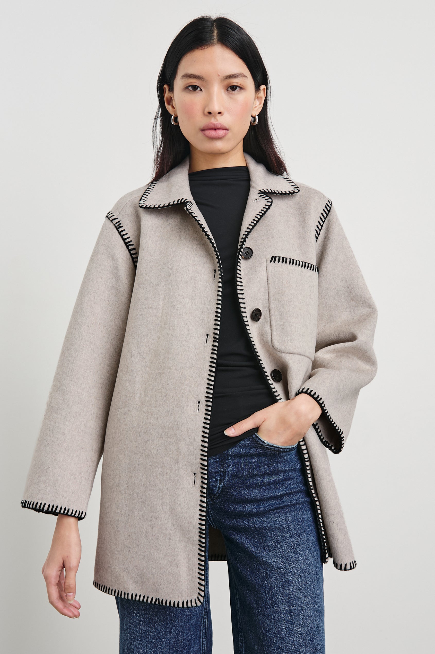 Odyssey Jacket with Four Button Closure and a Chest Patch Pocket in Oatmeal Colorway, with black contrast stitching - Front View Featured on Model
