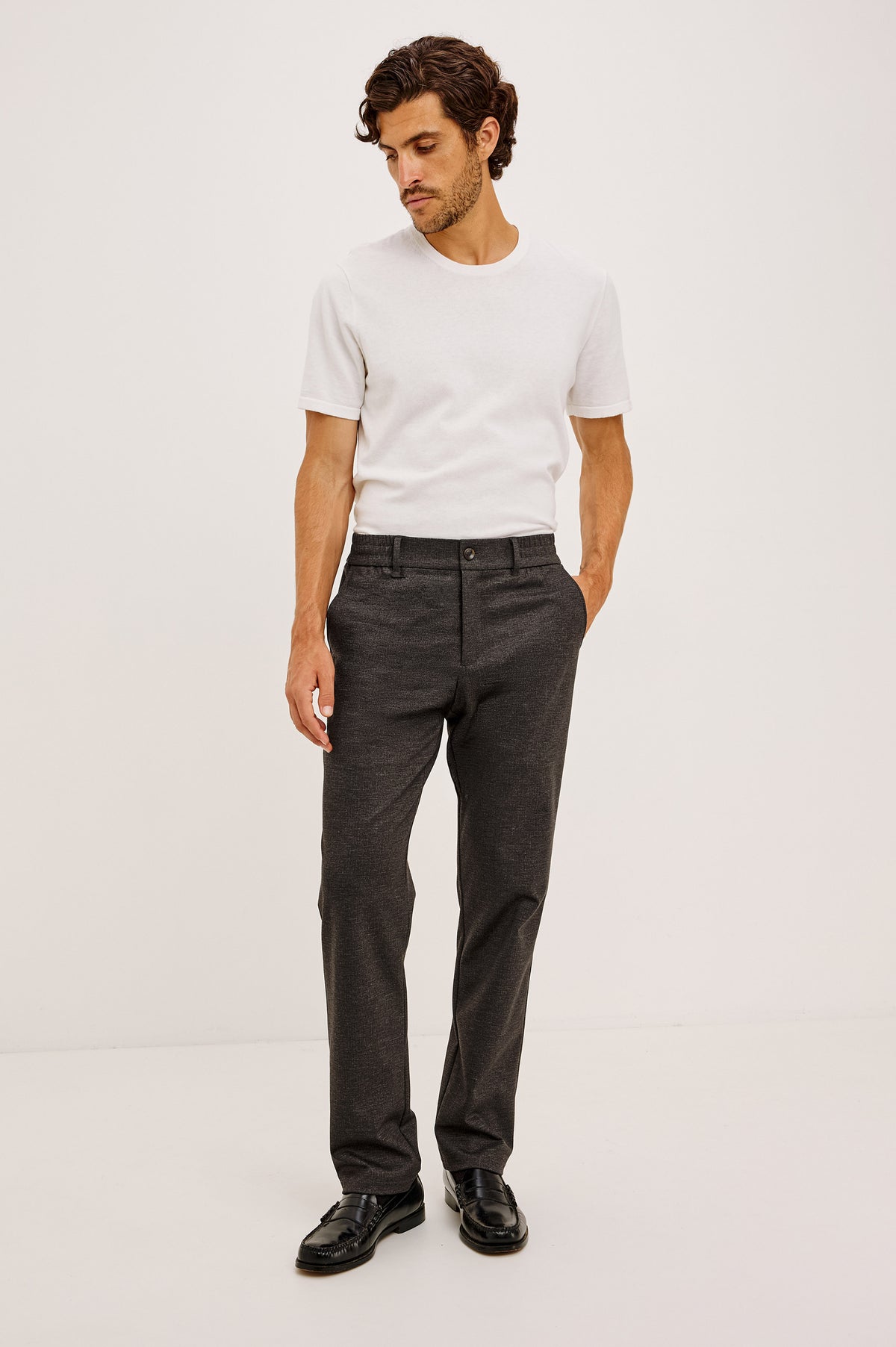 Olivier Pant in Stretch Ponte Knit With Slim Legs, Clean Front Waistband With Belt Loops, Elasticated Sides and Back, Front Zip Fly, Side Slash Pockets, and Back Welt Pockets in Umber Colorway - Full Body Front View Featured on Model