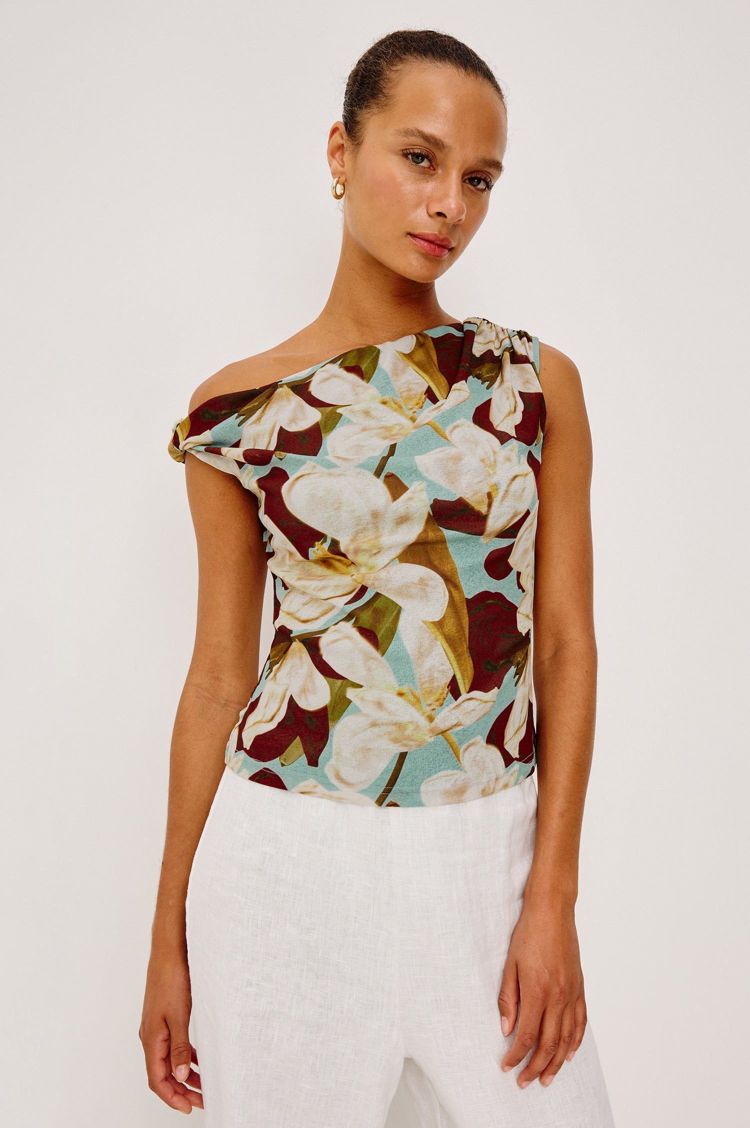 Orelia Fitted Top in Self-Lined Mesh With Twisted Shoulder Straps, and Asymmetrical One Shoulder Neckline in Plumeria Colorway - Upper Body Front View Featured on Model