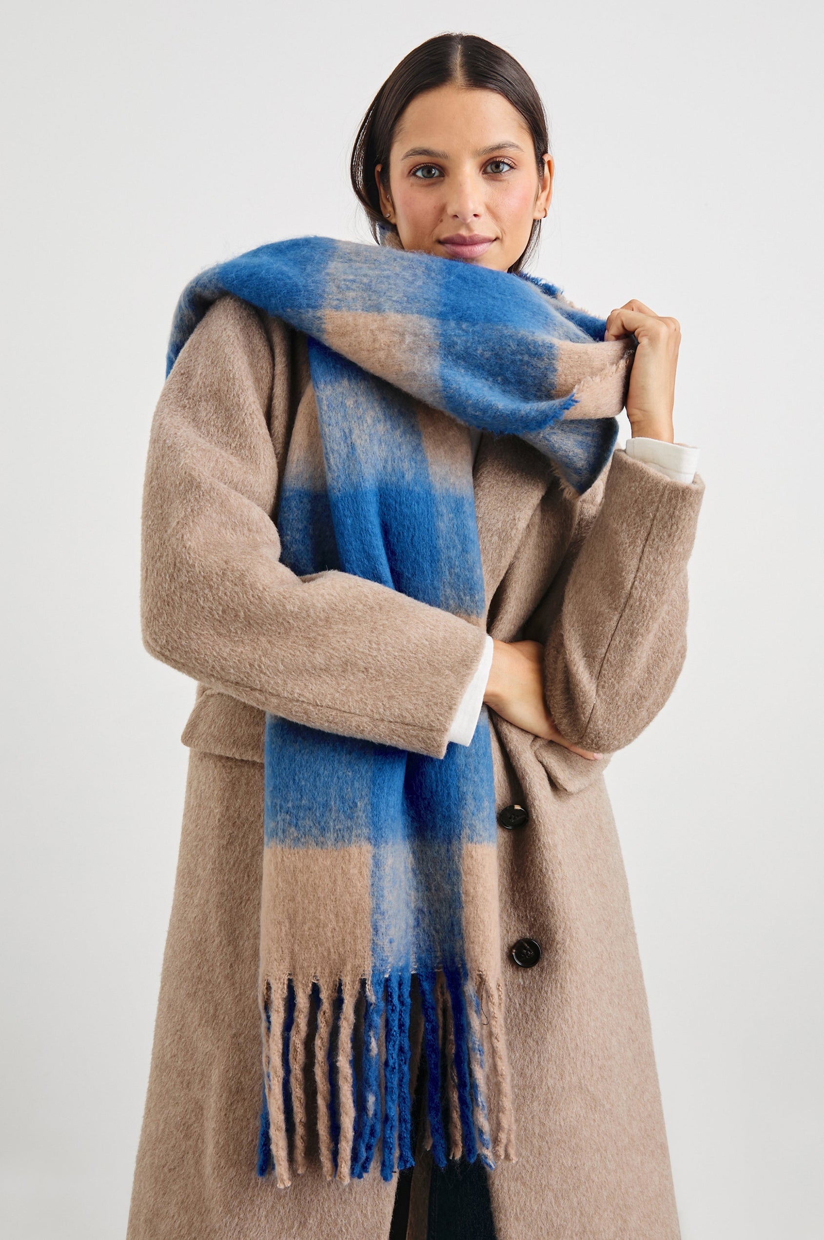 Oslo Scarf with Twisted Tassels and a Checkered Pattern in Cobalt Camel Colorway - Front View Featured on Model