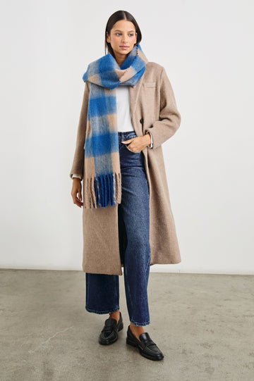 Oslo Scarf with Twisted Tassels and a Checkered Pattern in Cobalt Camel Colorway - Front Full Body View Featured on Model