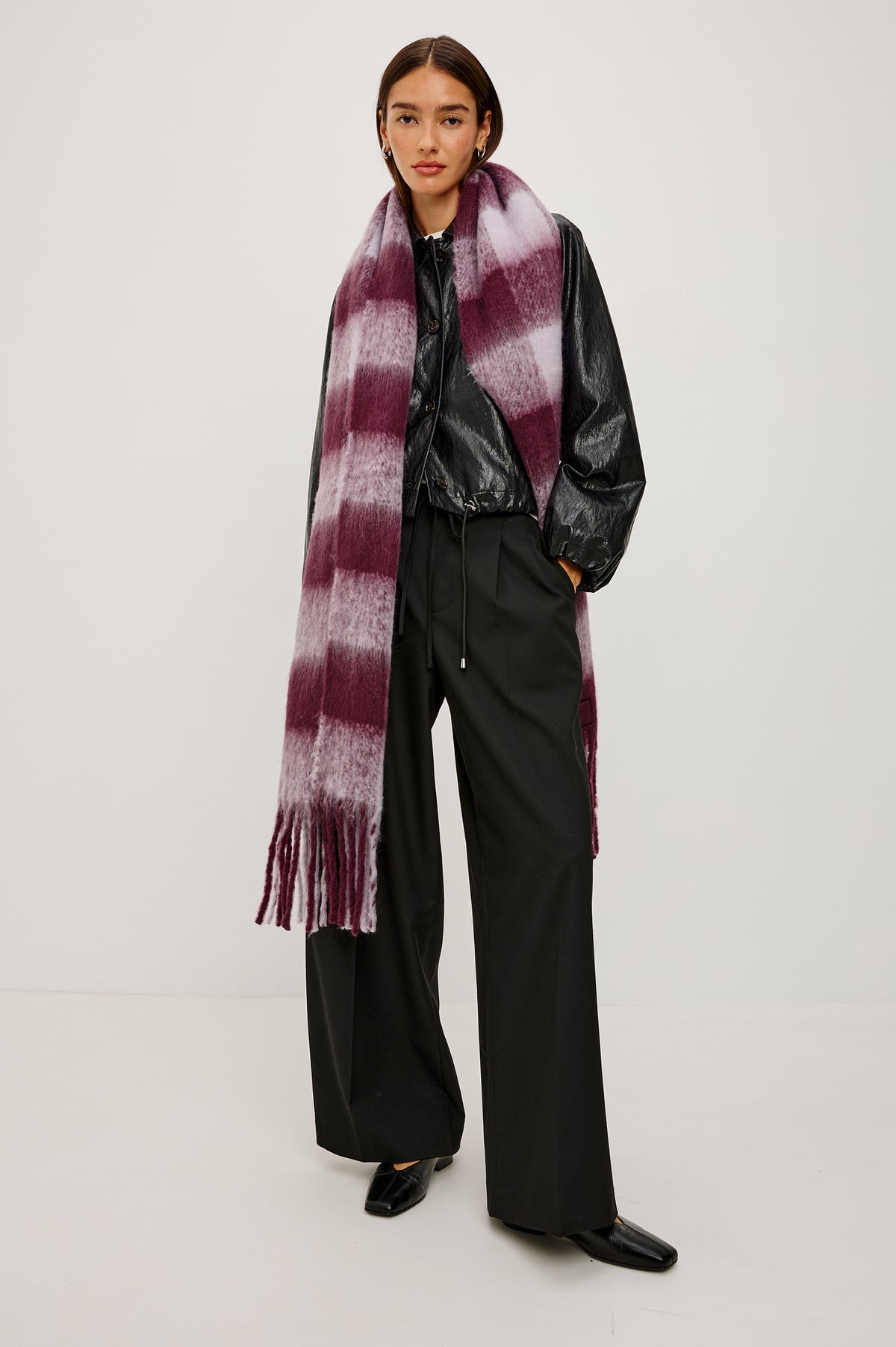 Oslo Oversized Knit Scarf With Fringe Trim in Wine Lilac Check Colorway - Full Body Front View Featured on Model