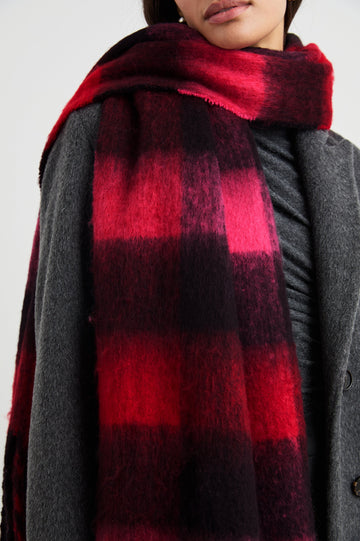 Oslo Scarf with Twisted Tassels and a Checkered Pattern in Scarlet Onyx Pink Colorway - Front View Featured on Model