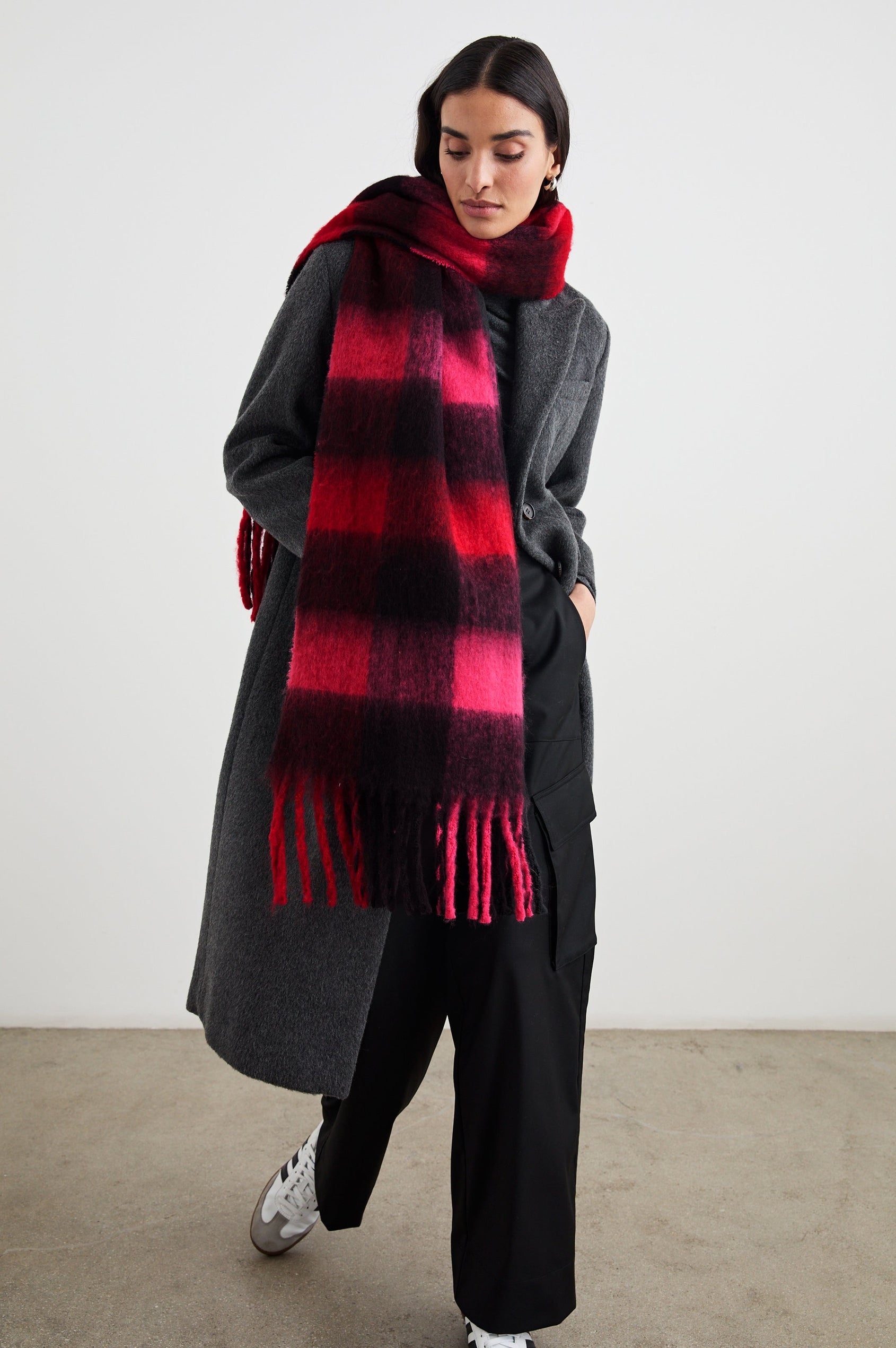 Oslo Scarf with Twisted Tassels and a Checkered Pattern in Scarlet Onyx Pink Colorway - Front Full Body View Featured on Model