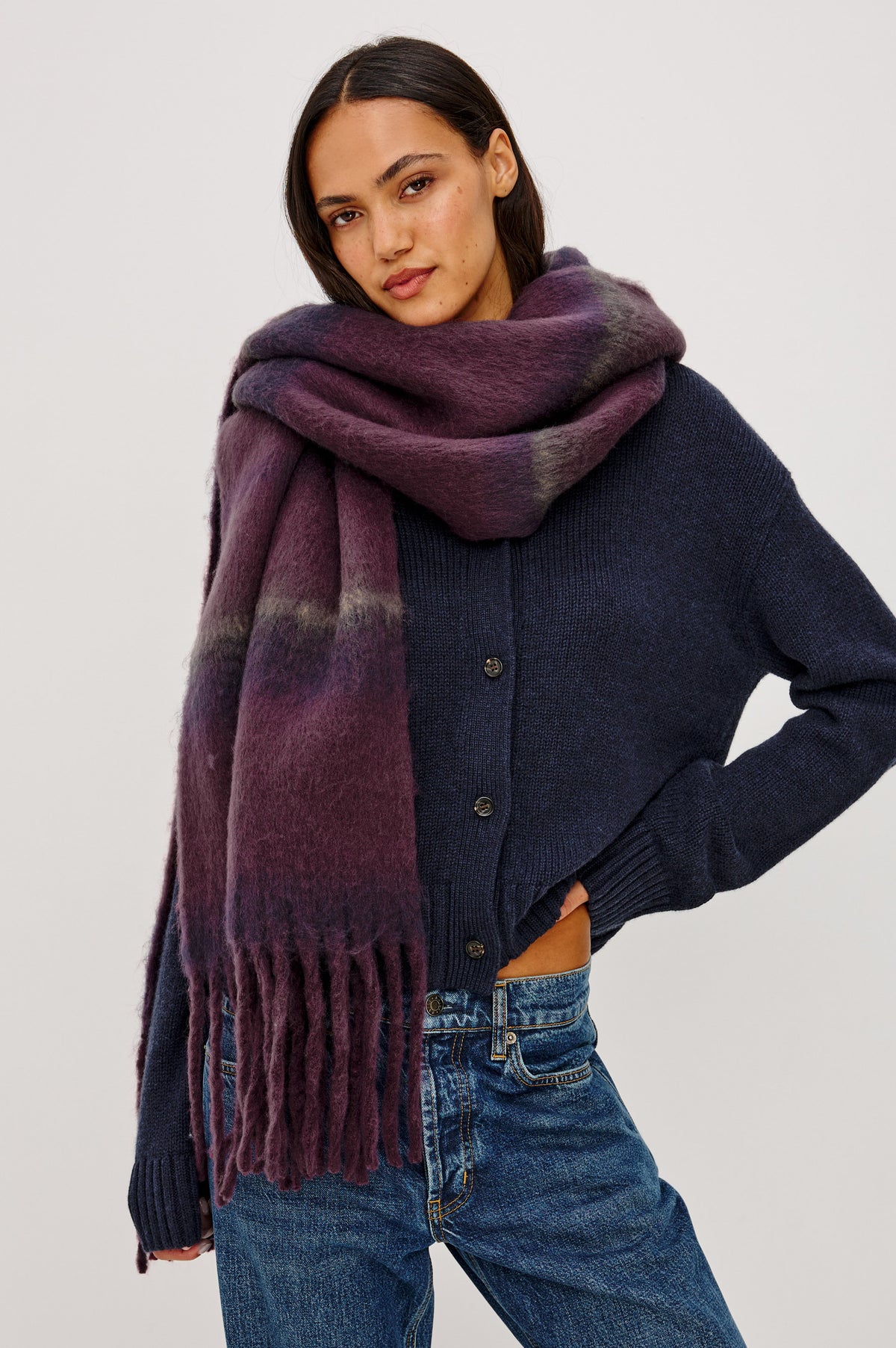 Oslo Scarf in Brushed Polyester Knit With Oversized Shape and Fringe Trim in Wine Indigo Stripe Colorway - Upper Body Front View Featured on Model.