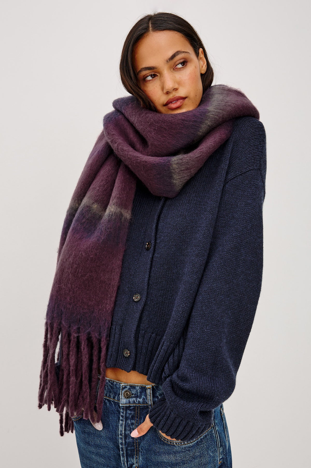 Oslo Scarf in Brushed Polyester Knit With Oversized Shape and Fringe Trim in Wine Indigo Stripe Colorway - Front View Featured on Model.