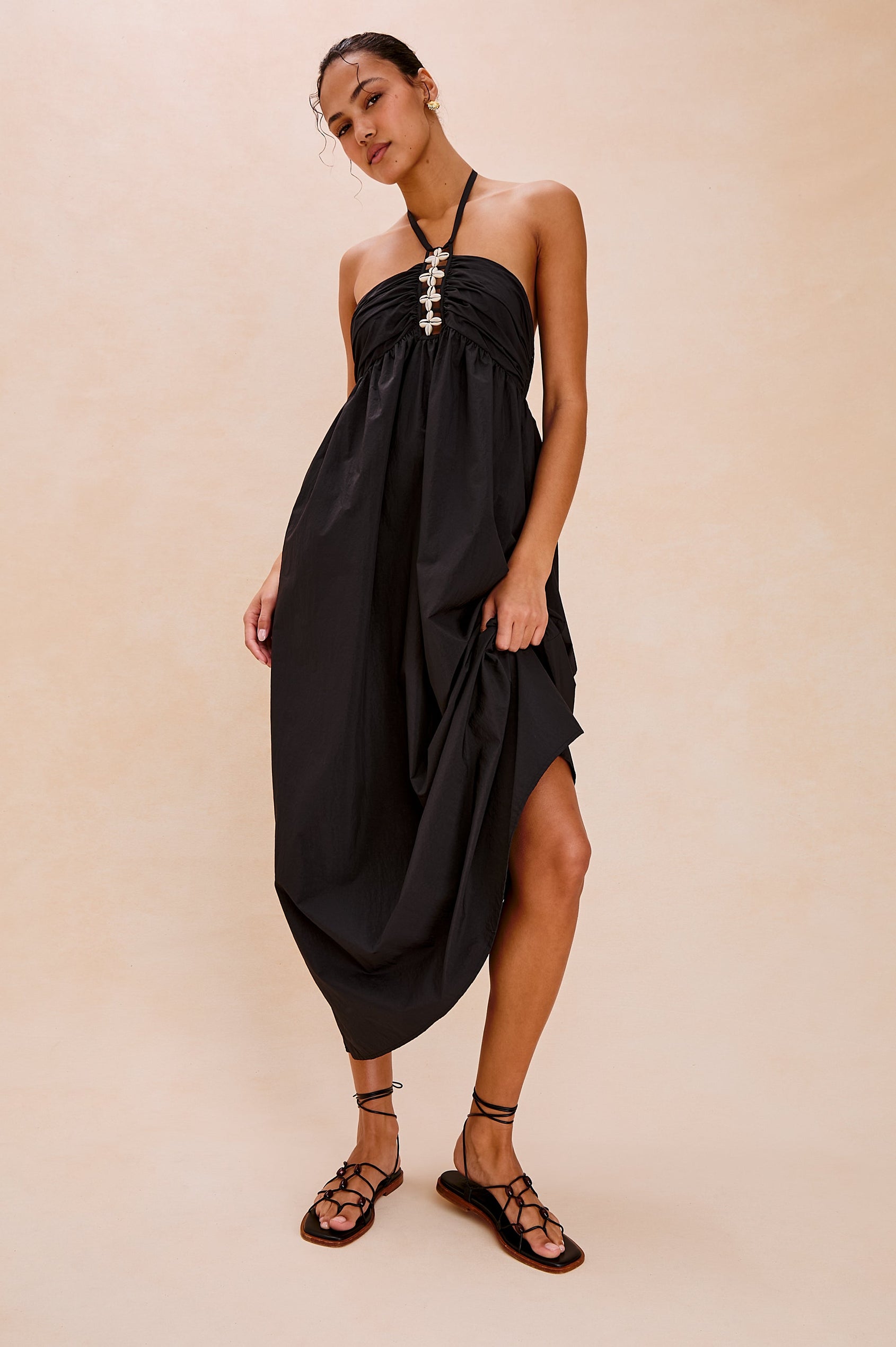 Palazzo Halter Midi Length Dress with Tie Neck and Sea Shell Lattice Detail at Center Front in Black Colorway. Full Body Front View Shown on Model.