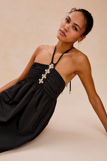 Palazzo Halter Midi Length Dress with Tie Neck and Sea Shell Lattice Detail at Center Front in Black Colorway. Front View Shown on Model.