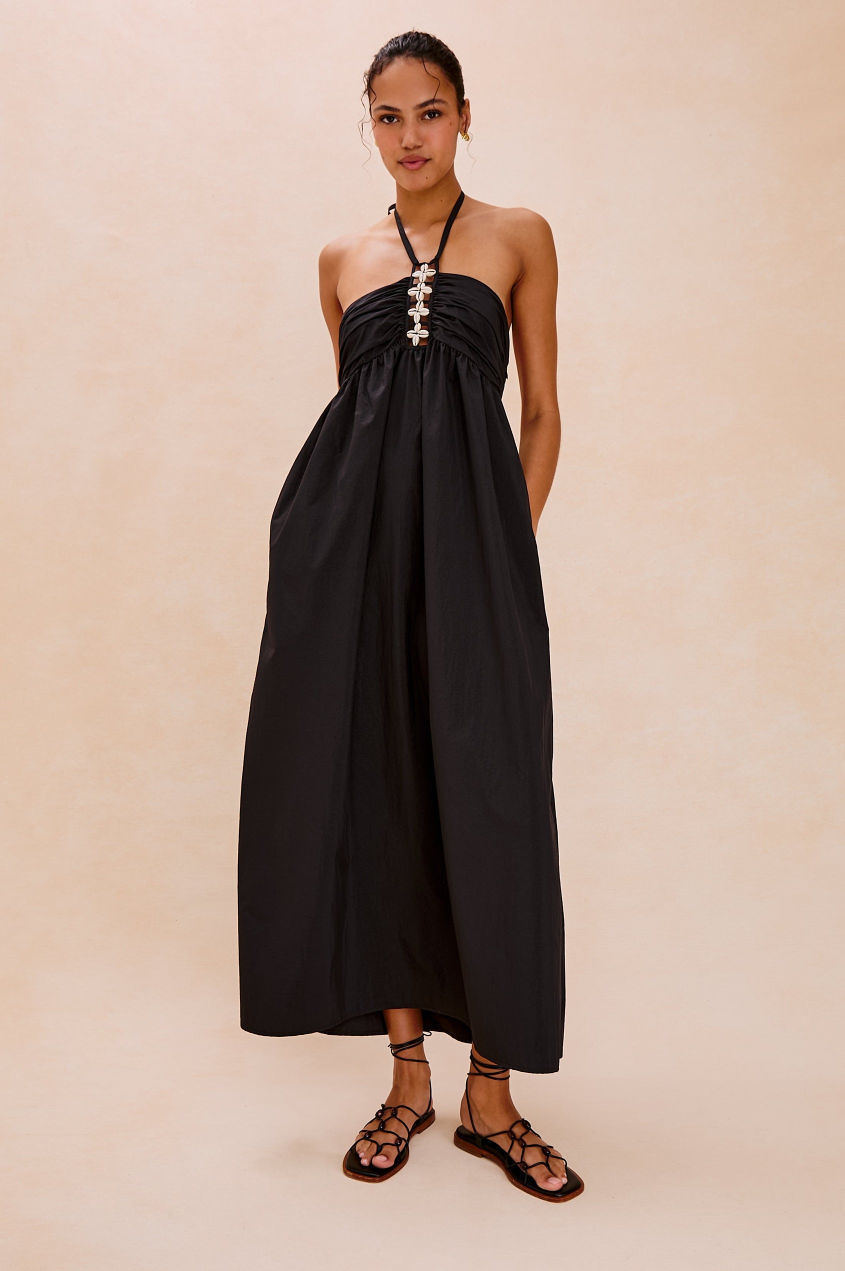 Palazzo Halter Midi Length Dress with Tie Neck and Sea Shell Lattice Detail at Center Front in Black Colorway. Full Body Front View Shown on Model.