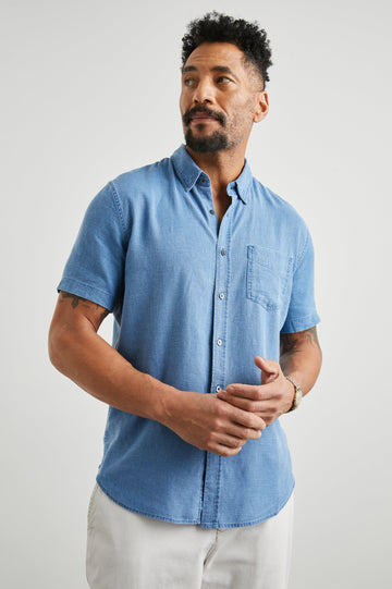 Paros Short-Sleeve Button Up with a Chest Patch Pocket in Celsius Colorway, a Blue - Front View Featured on Model