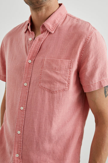 Paros Short-Sleeve Button Up with a Chest Patch Pocket in Equator Colorway, a Pink - Front View Featured on Model