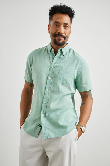 Paros Short-Sleeve Button Up with a Chest Patch Pocket in Jade Colorway - Front View Featured on Model
