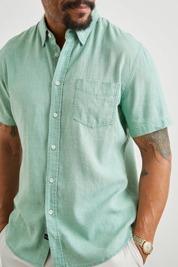 Paros Short-Sleeve Button Up with a Chest Patch Pocket in Jade Colorway - Front View Featured on Model