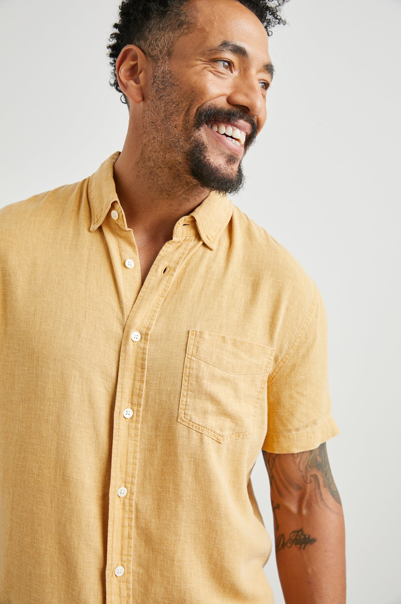 Paros Short-Sleeve Button Up with a Chest Patch Pocket in Uni Colorway, a Yellow - Front View Featured on Model