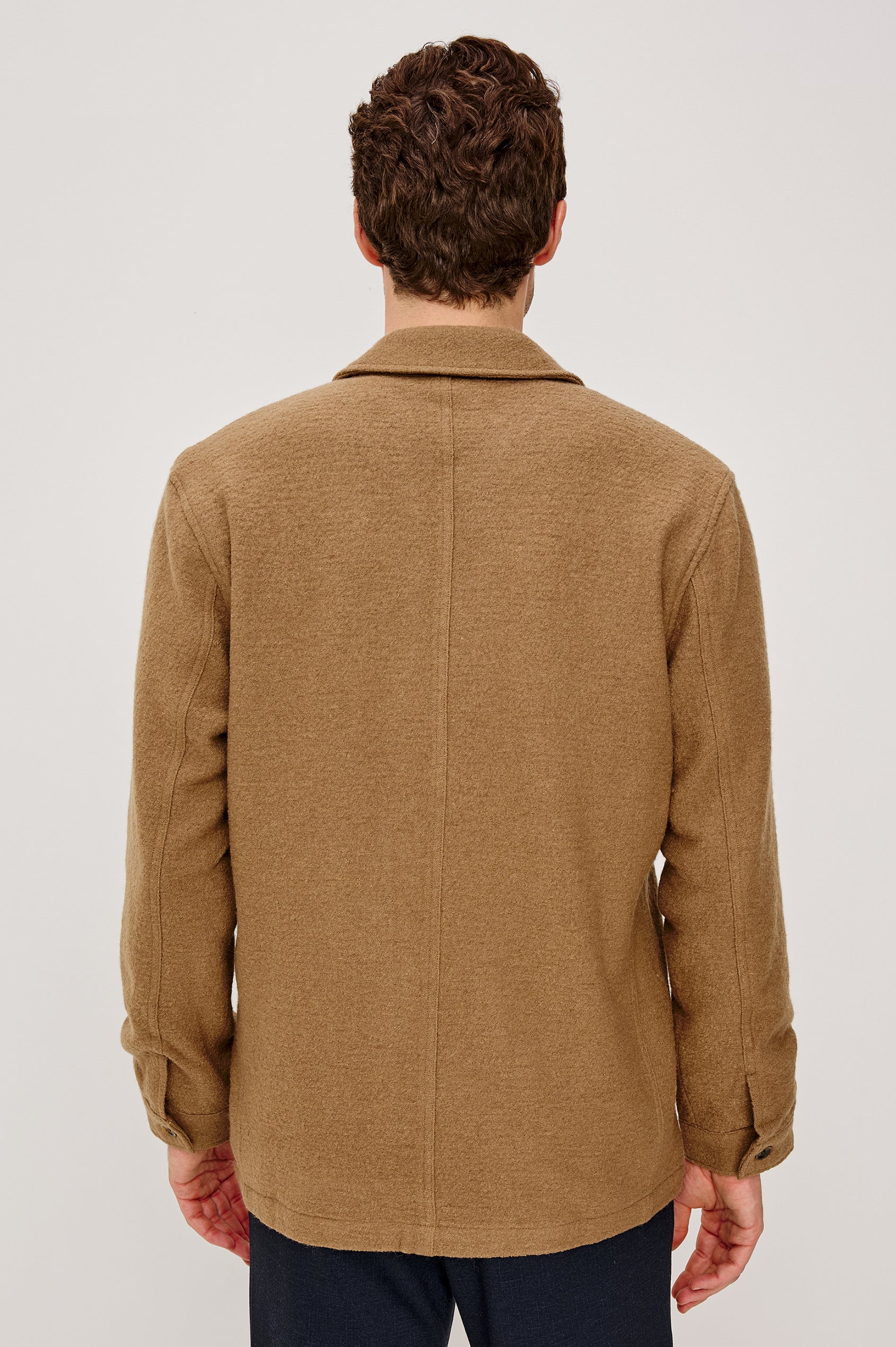 The Pascal is a collared button front jacket with front patch pockets and a chest pocket in Light Brown Boucle colorway. Back full body view featured on model.