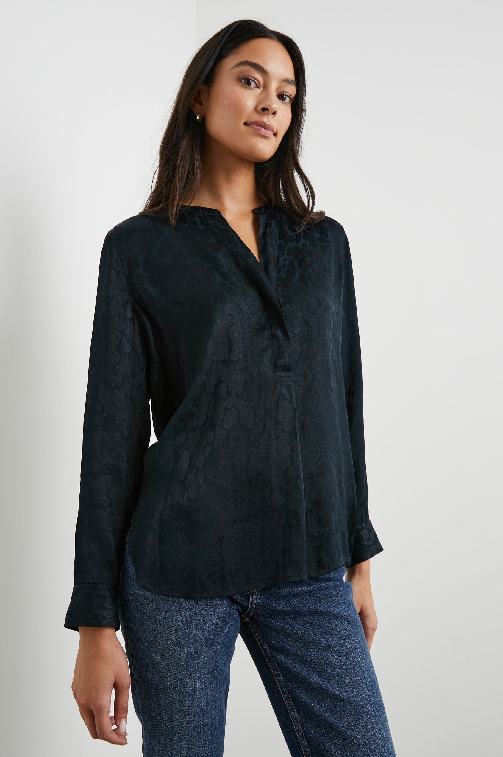 Pearl Long-Sleeve Top with a Half Sealed Placket, Button Cuffs and Side Slits in Onyx Leopard Colorway, Black Spots on Black - Front View Featured on Model 