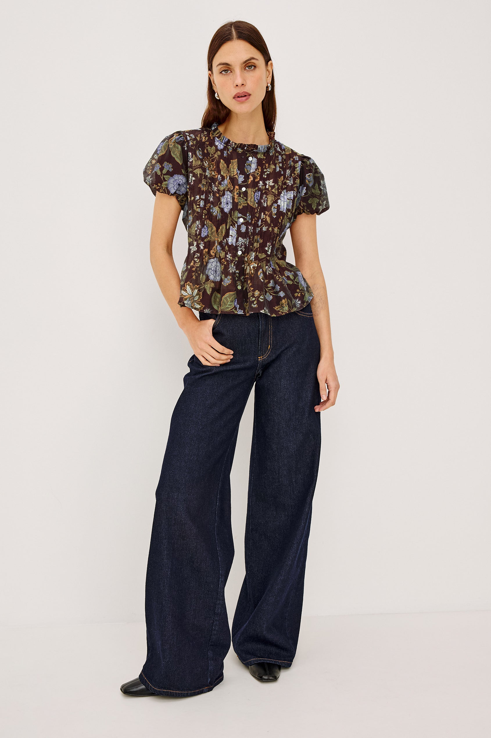 Pepper Shirt in Cotton Poplin With Loose Boxy Fit, Pintuck Detailing, Puff Cap Sleeves, Center-Front Buttons, and Soft Peplum Hem in Willow Colorway - Full Body Front View Featured on Model