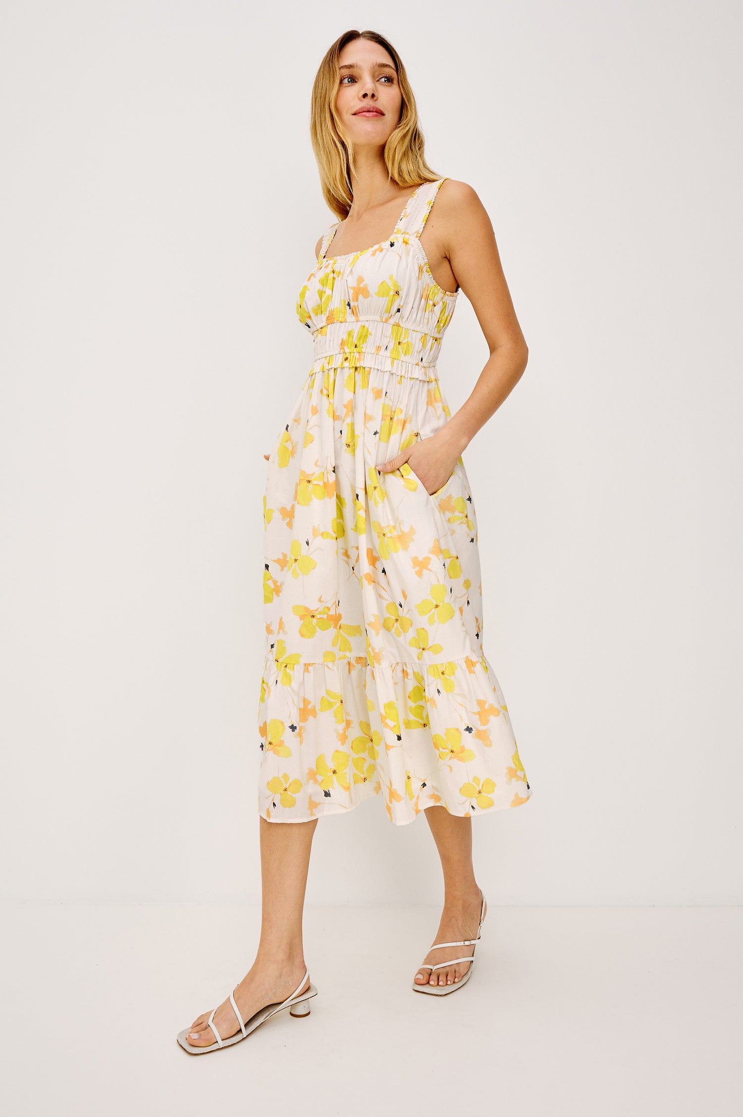 Rafaella Midi Dress in Cotton Poplin With Wide Smocked Shoulder Straps, Gathered Bust, Elasticwated Waist, and Side Pockets in Tossed Daffodils Colorway - Full Body Front View Featured on Model