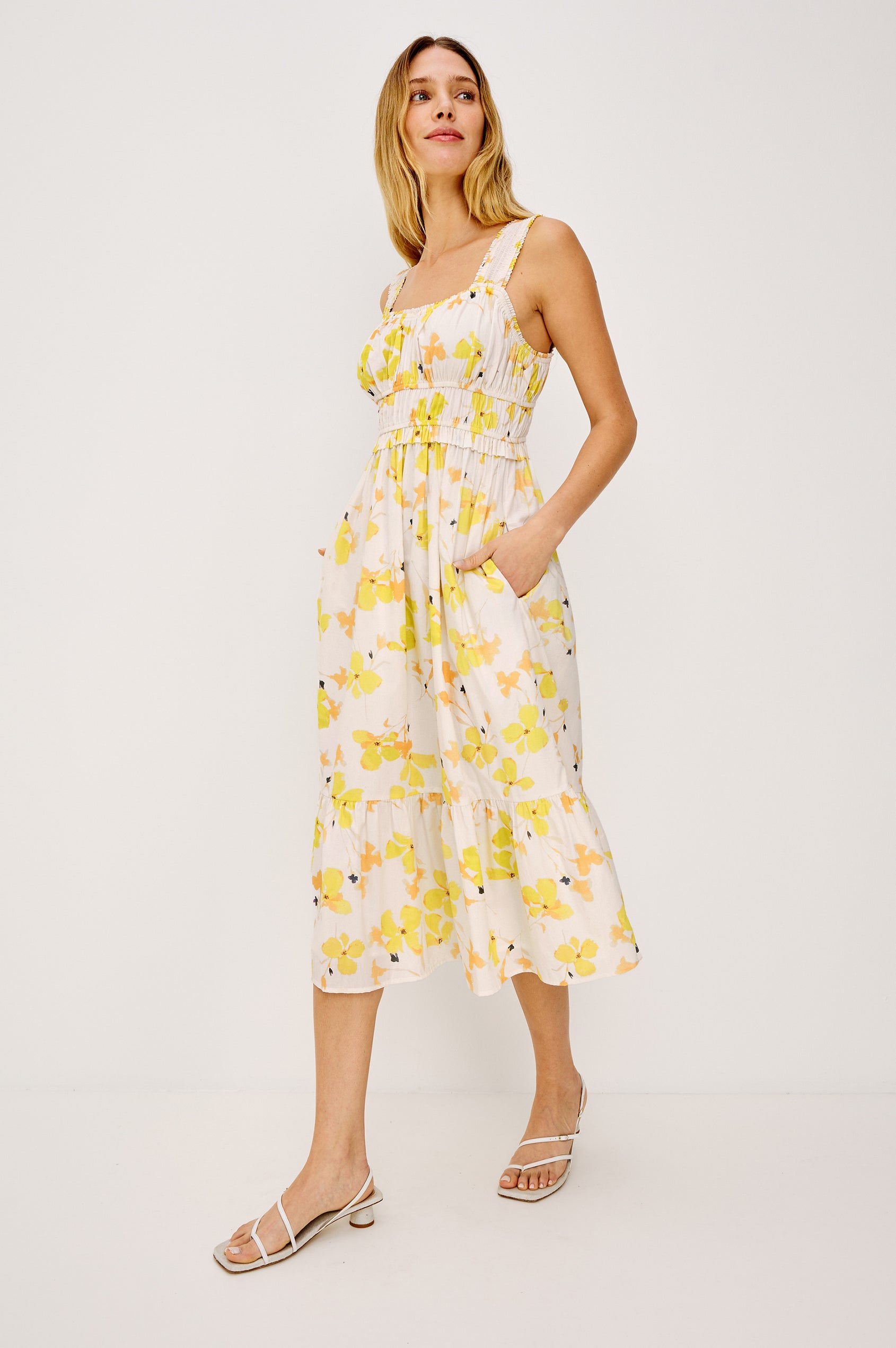 Rafaella Midi Dress in Cotton Poplin With Wide Smocked Shoulder Straps, Gathered Bust, Elasticwated Waist, and Side Pockets in Tossed Daffodils Colorway - Full Body Front View Featured on Model