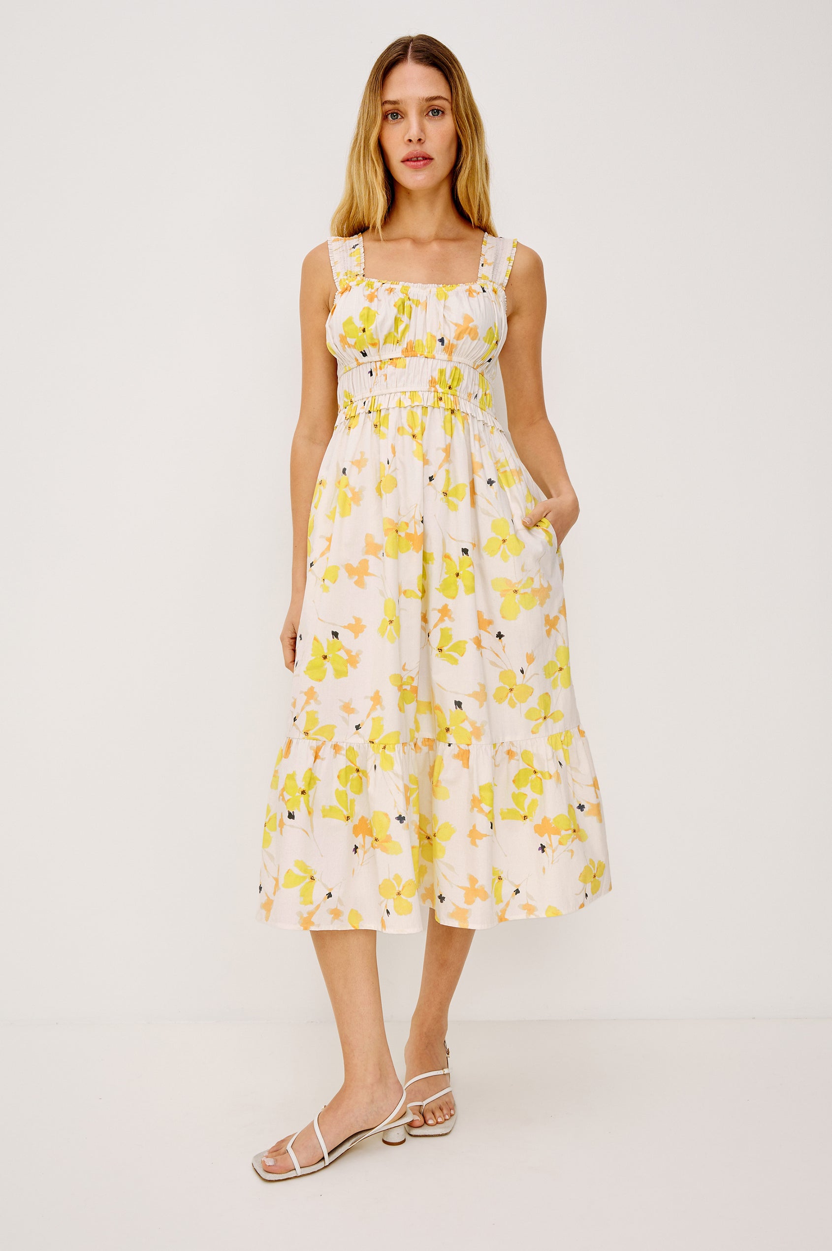 Rafaella Midi Dress in Cotton Poplin With Wide Smocked Shoulder Straps, Gathered Bust, Elasticwated Waist, and Side Pockets in Tossed Daffodils Colorway - Full Body Front View Featured on Model