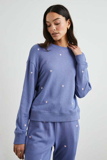 Ramona Long-Sleeve Sweatshirt with a Crew Neck in Pink Periwinkle Hearts Embroidery Colorway, Pink Hearts on Periwinkle - Front View Featured on Model