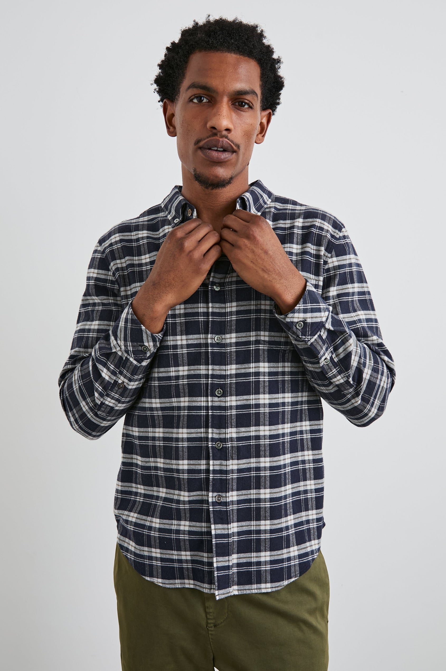 Reid Long-Sleeve Button Up with a Patch Pocket in Navy Lentil Cream Colorway, a Navy, Cream and Brown plaid - Front View Featured on Model