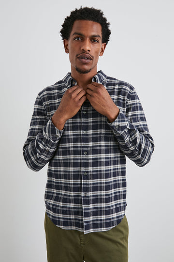 Reid Long-Sleeve Button Up with a Patch Pocket in Navy Lentil Cream Colorway, a Navy, Cream and Brown plaid - Front View Featured on Model