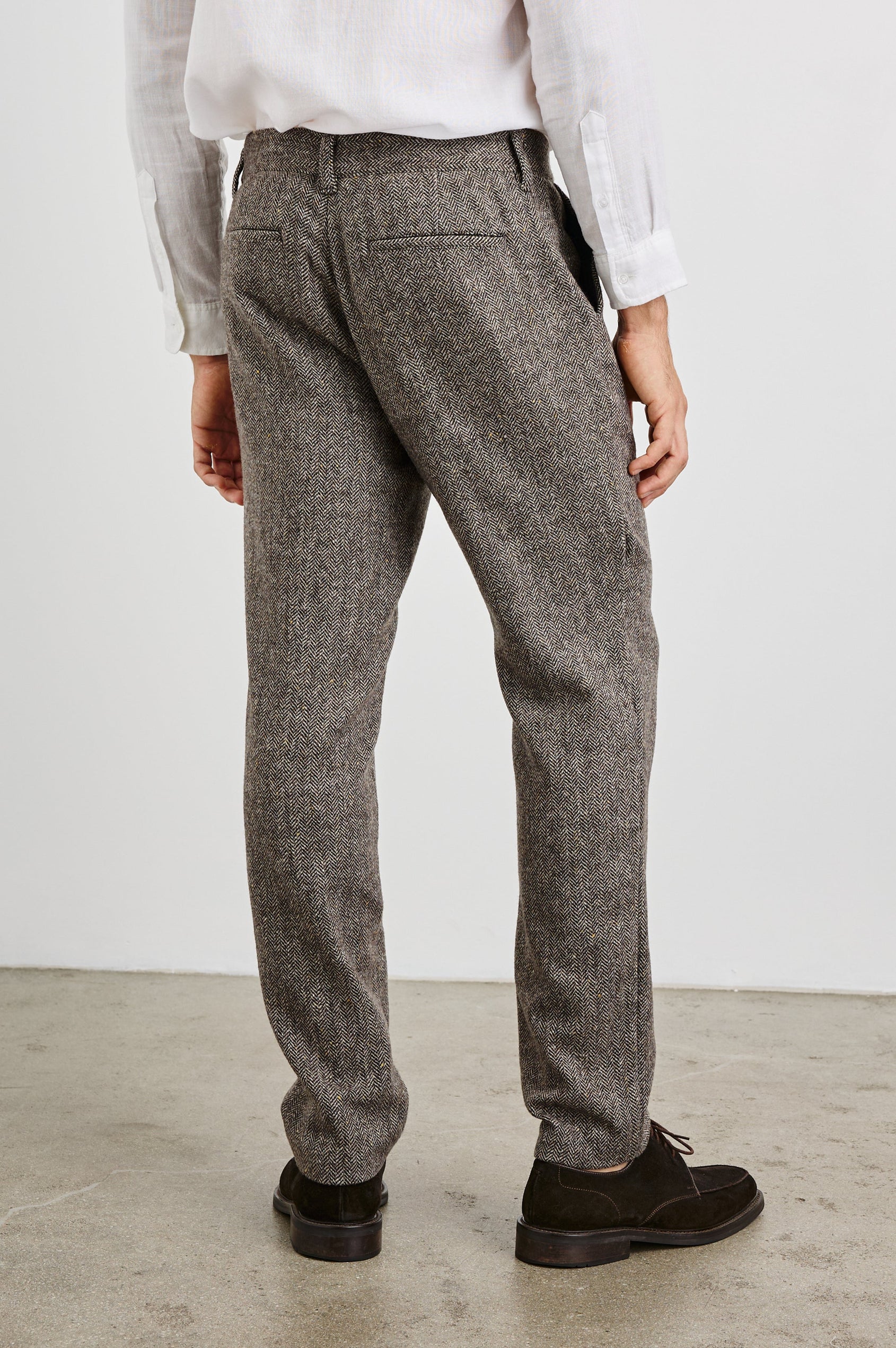 Reynard Blazer with Two Button Closure, Two Front Pockets, a Chest Welt Pocket, Herringbone Fabric in Highland Tweed Colorway, a Brown - Back Full Body View Featured on Model