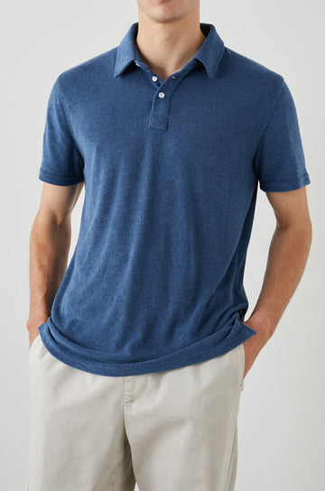 Rhen Short-Sleeve Polo Shirt with a Three-Button Placket in Ensign Blue Colorway - Front View Featured on Model