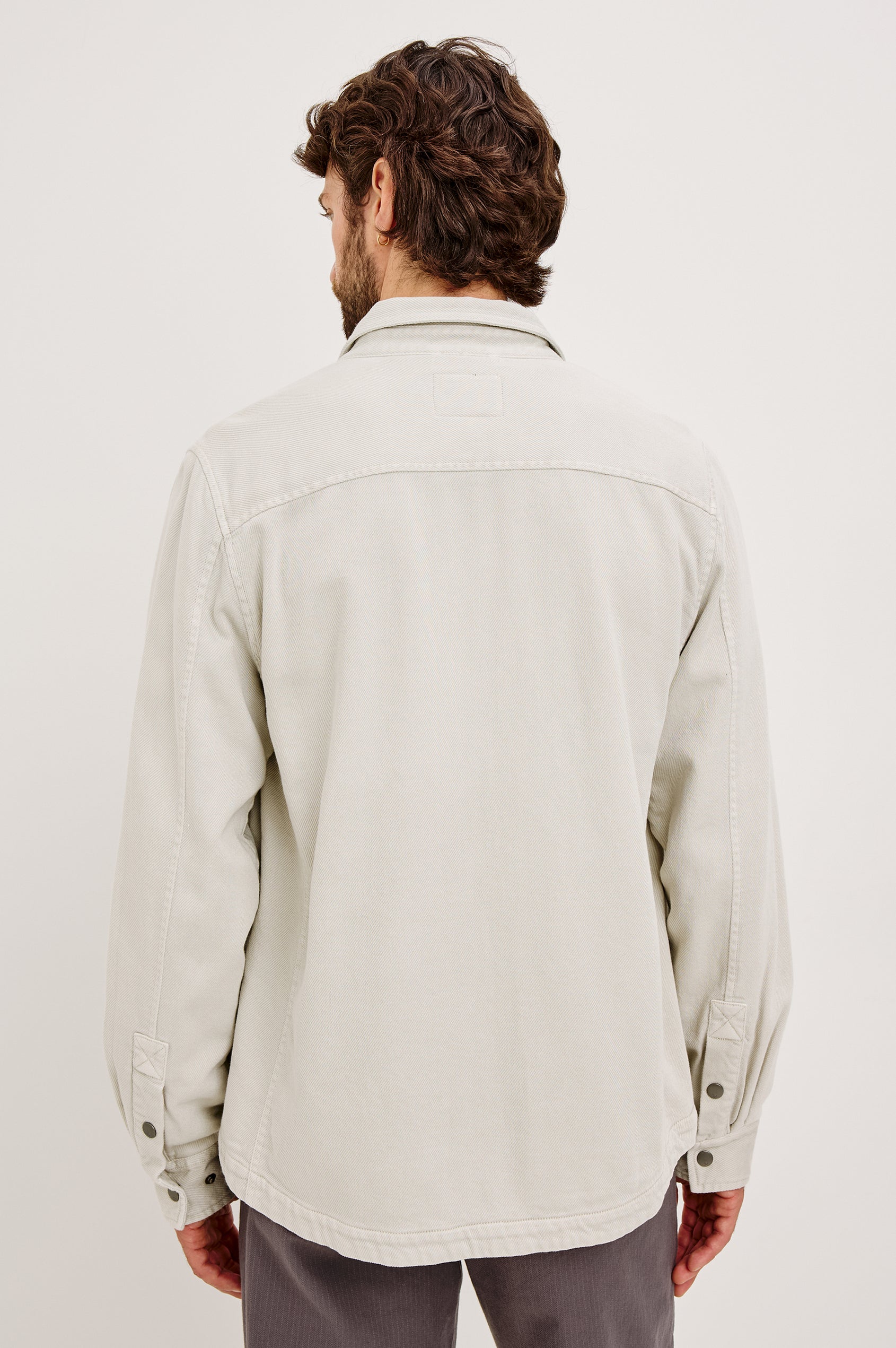 Rhett Shirt Jacket in Brushed Cotton Twill With On-Seam Side Pockets, Jersey Lining, Collar, Snap Button Front and Chest Flap Pockets in Medium Vintage Wash - Upper Body Back View Featured on Model